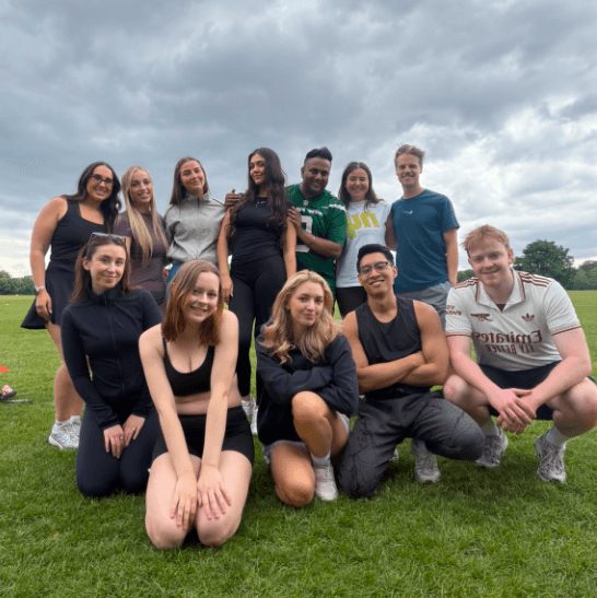 The Somerce sports team in kit on a grass pitch